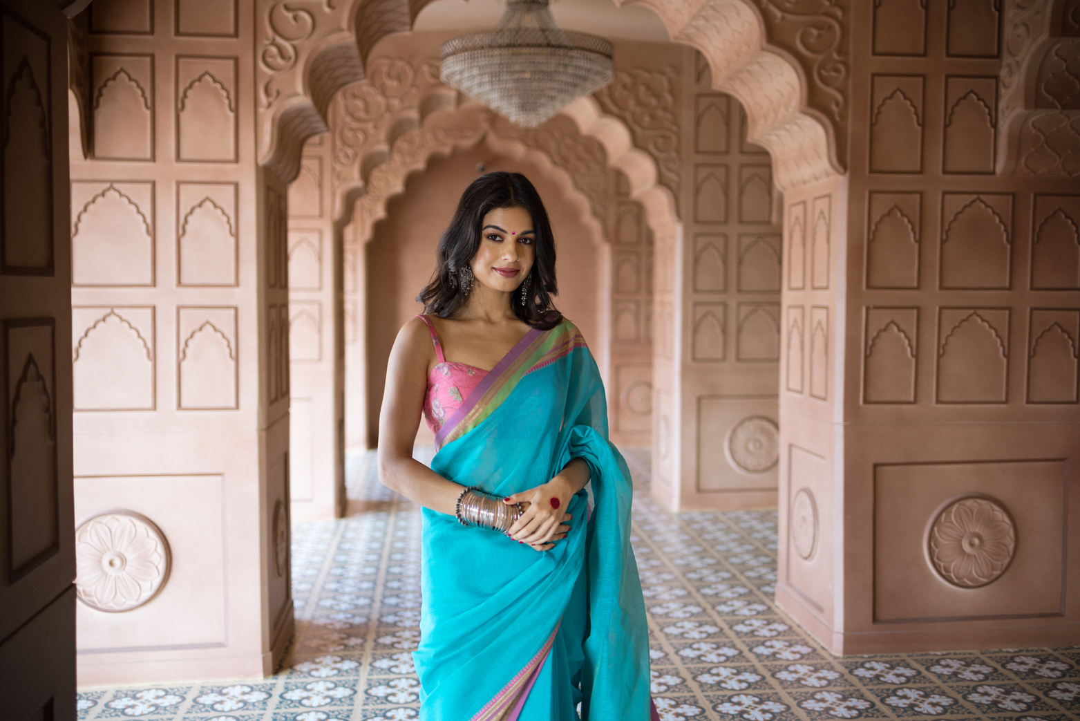 Woman Wearing a Saree Inside an Indian Architecture